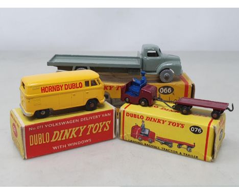 Three boxed Dublo Dinky Toys including 071 VW Delivery Van, 076 Lansing Bagnall Tractor Trailer and 066 Bedford Flat Truck, N
