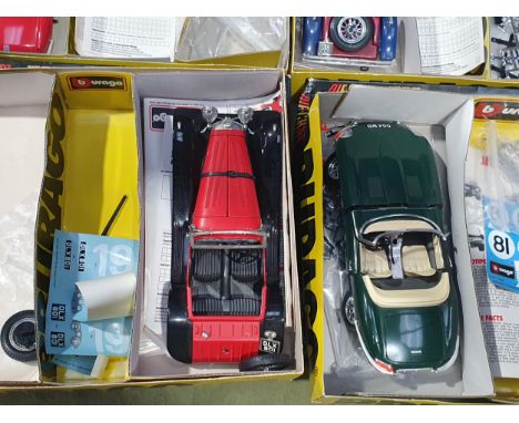 Four boxed Burago part completed 1:18 scale metal Kits including Lancia Aurelia Spider, Mercedes SSK, Jaguar SS100 and Jaguar