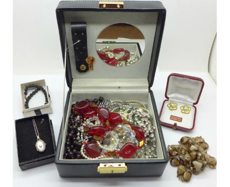 A jewellery box with vintage necklaces, silver locket and chain, silver and pearl earrings, etc.