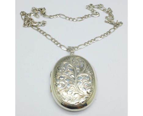 A large hallmarked silver locket and chain