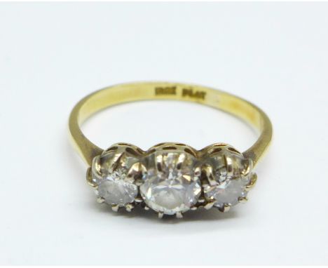 An 18ct gold and platinum set three stone diamond ring, 2.9g, O