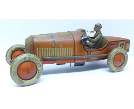 A large pre-war Tipp &amp; Co tin-plate clockwork racing car with original battery-powered light, made in Germany, length 47c
