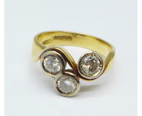 An 18ct gold, three stone diamond ring, 3.8g, H