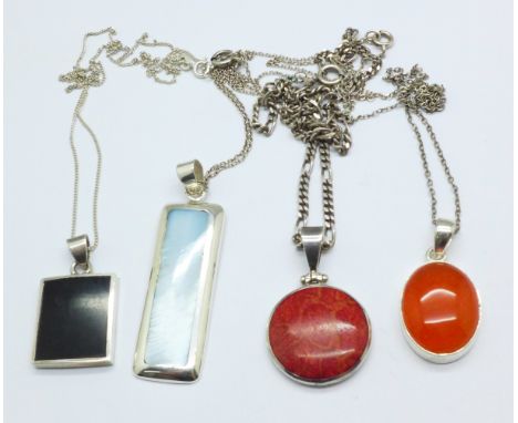 Four silver stone set pendants and chains