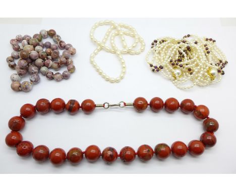 Two agate necklaces, a freshwater pearl and garnet necklace which can be converted to a bracelet and choker, and one other pe