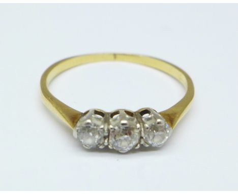 An 18ct gold, three stone diamond ring, 1.9g, Q