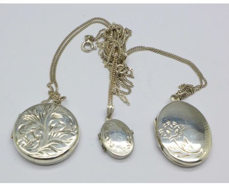 Three silver lockets and chains