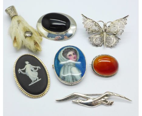 Seven silver and silver mounted brooches