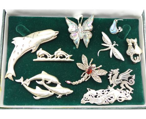 Ten silver brooches