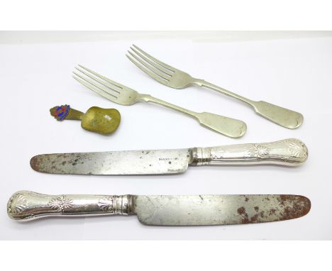 Two knives with silver covered handles and with Georgian hallmarks, two forks and a caddy spoon