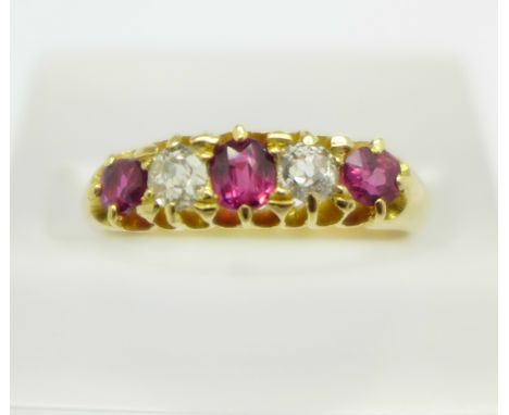 An 18ct gold, ruby and diamond five stone ring, 2.9g, O