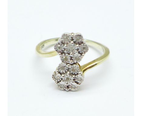 A silver gilt, fourteen diamond double daisy cluster ring, Q