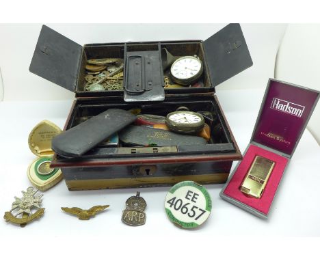 Two silver cased pocket watches, a silver ARP badge, a Notts &amp; Derby badge, pocket knives, etc.