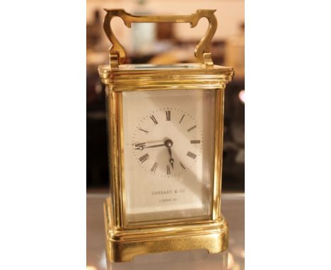 Garrard brass carriage clock with key, working at lotting up