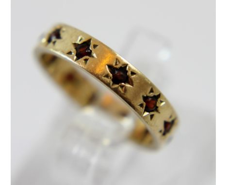 Ladies 9 ct gold garnet set band ring, Size K 