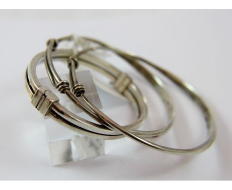 Three sterling silver bangles, 52g