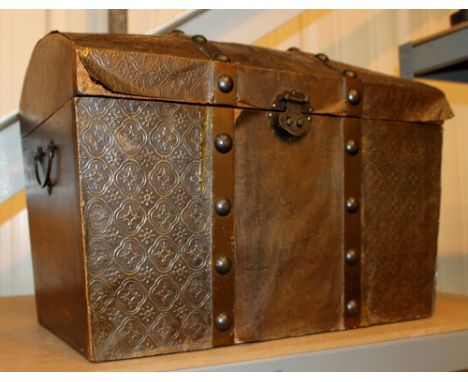 Old embossed trunk with angelic decoration baize lined