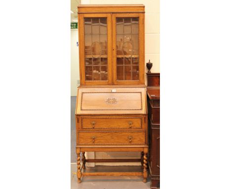 Light oak bureau bookcase with fitted interior and barley twist supports. Keys in office 74 x 90 x 42 cm