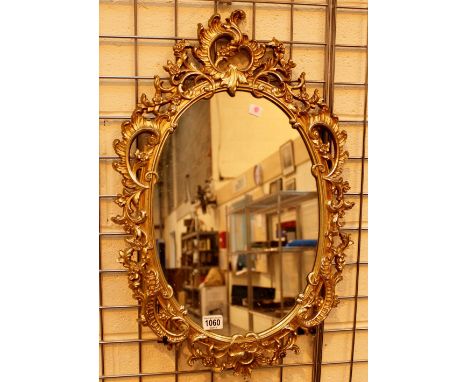 Gilt wood framed oval mirror 30 x 45 cm