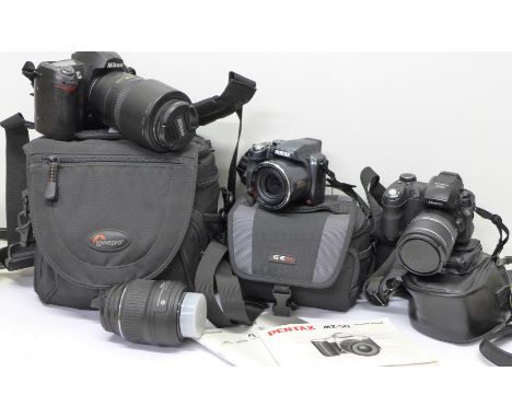 A Nikon D70S digital camera with Nikon DX AF-S Nikkor 55-300mm 1:4.5-5.6 GED lens, boxed, a Pentax MZ-50 digital camera and a