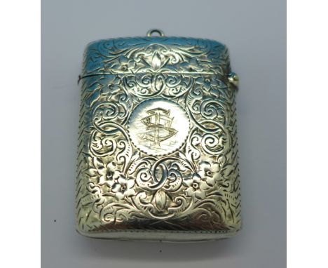 A Victorian silver vesta case, Birmingham 1894, thistle decoration lacking enamel