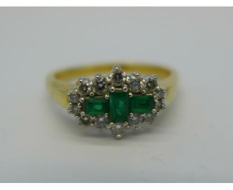 An 18ct gold, emerald and diamond ring, 5.3g, S