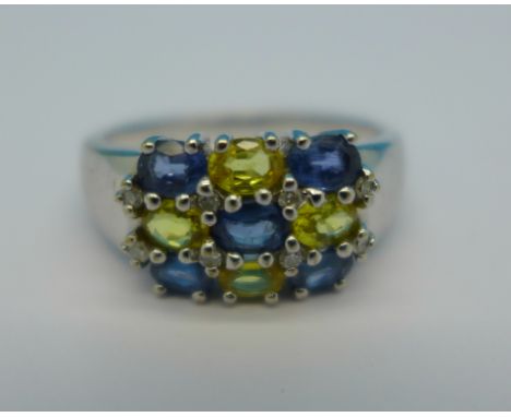 A 9ct white gold, diamond, blue and yellow stone ring, 5.8g, S