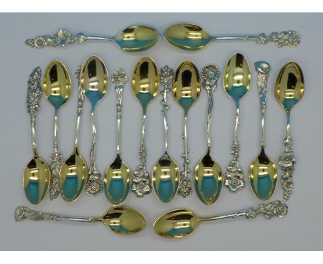 Eight pairs of sterling silver coffee spoons by Reed & Barton with flower handles, 180g