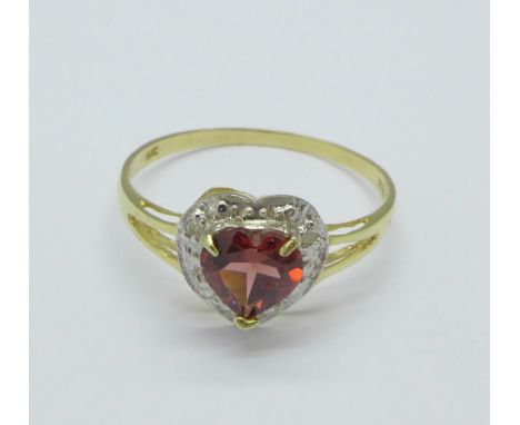 A 9ct gold, garnet and diamond ring, 1.1g, O