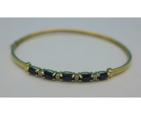 A 9ct gold, sapphire and diamond bangle, 4.7g