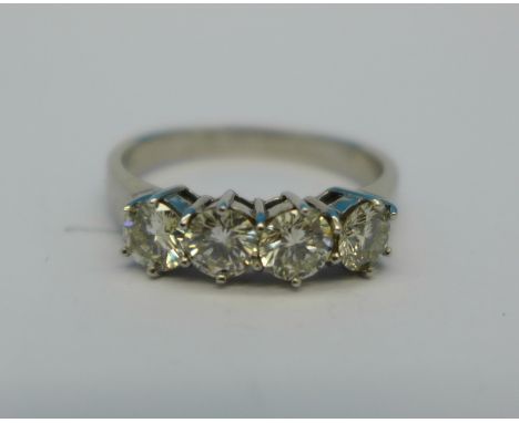 An 18ct white gold, four stone diamond ring, 1 carat total diamond weight, 3.2g, L