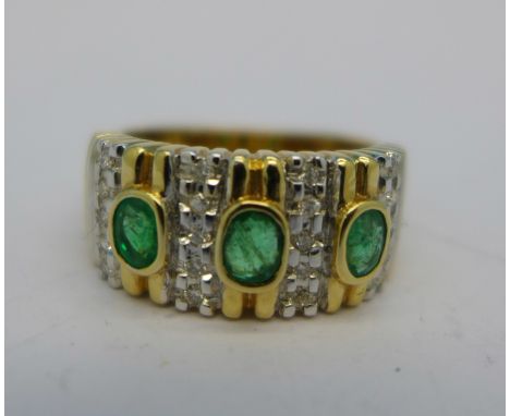 An emerald and diamond set ring, marked 585, 6g, N