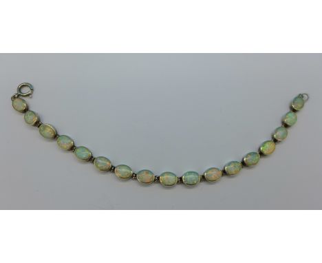 A silver and opal bracelet