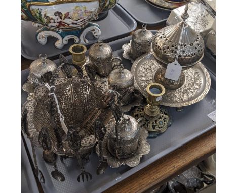 A tray of metalware to include: set of silver-plated Persian design cups and saucers with porcelain liners, brass candlestick