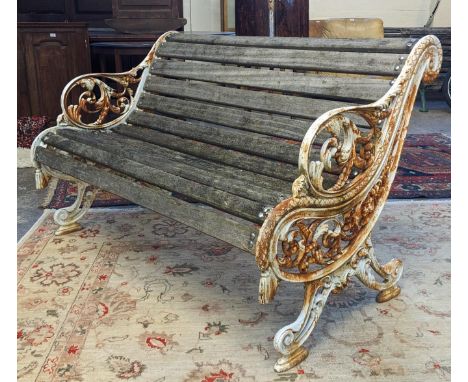 Heavy cast iron scrolled foliate design garden bench with wooden slats (smaller,matches previous lot). 126cm wide approx. (B.
