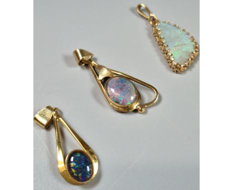 Three 9ct gold and opal pendants. (3) (B.P. 21% + VAT)