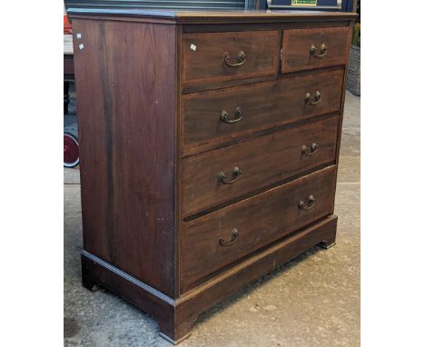 Edwardian mahogany cross-banded straight fronted chest of two short and three long drawers on bracket feet in Georgian style.