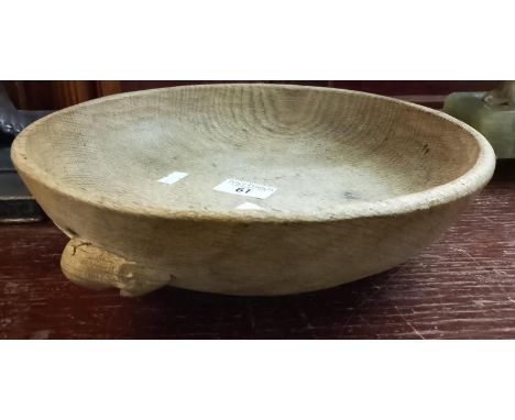 Workshop of Robert 'Mouseman' Thompson (Kilburn), a carved oak nut bowl with carved mouse trademark to the exterior. 27cm dia