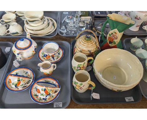 A china tea for two set decorated with parrots, flowers and foliage together with a tray of ceramics to include: Art Deco Myo