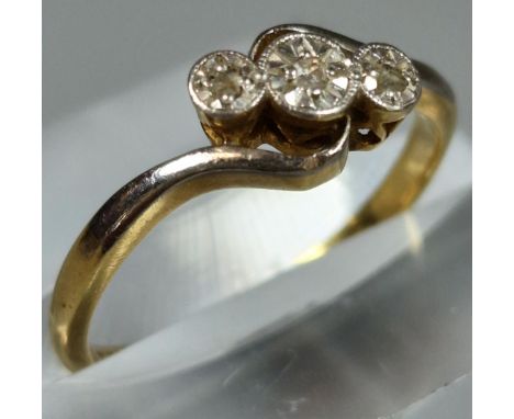 18ct gold platinum and diamond three stone twist shank ring. 2.5g approx. Ring size M. (B.P. 21% + VAT)