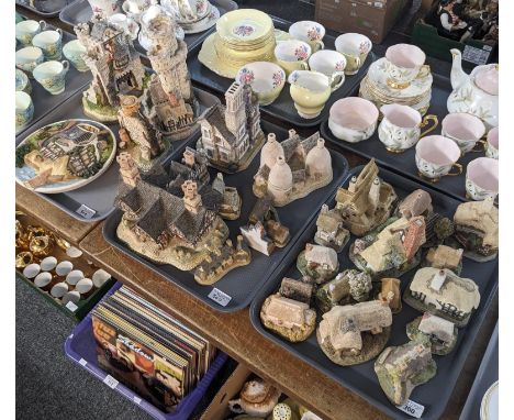 Three trays of David Winter cottages and architectural buildings together with a David Winter 'On the Riverbank' wall plate. 