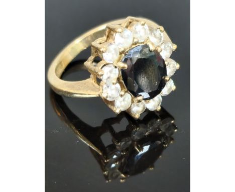 9ct gold clear and blue stone cluster ring. 5.5g approx. Ring size M. (B.P. 21% + VAT)