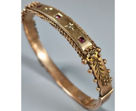 9ct rose gold diamond and ruby ladies' bangle. 11g approx. (B.P. 21% + VAT)