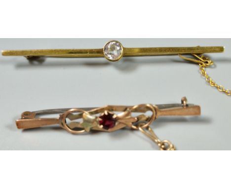 Edwardian 9ct gold and ruby bar brooch. 1.6g approx. Together with another 9ct gold and blue stone bar brooch. 2.4g approx. (
