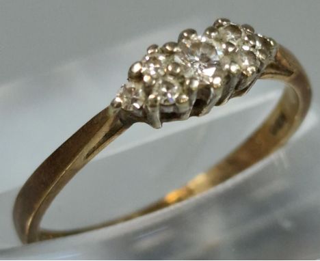 9ct gold diamond seven stone ring. 1.2g approx. Ring size K 1/2. (B.P. 21% + VAT)