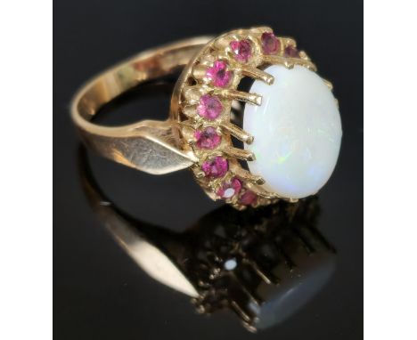 9ct gold opal and red stone cluster ring. 4.8g approx. Ring size P. (B.P. 21% + VAT)