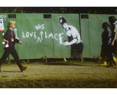 'I LOVE THIS PLACE' graffiti by Banksy photographed at Glastonbury, hand signed print by the founder of festival Michael Eavi
