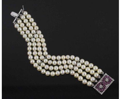 NICOLETTI MILAN, a four row cultured pearl bracelet to a rectangular ruby and diamond set eighteen carat white gold clasp, 19
