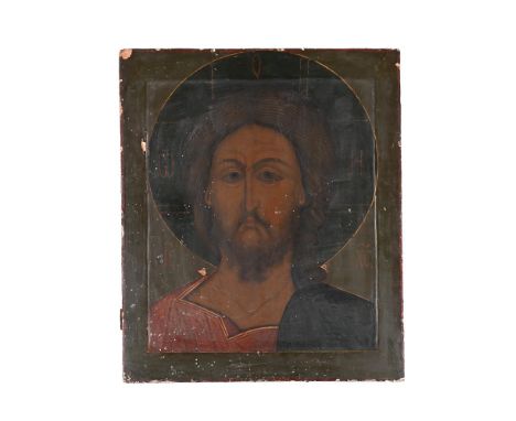 AN ICON OF THE CHRIST  PROBABLY BALTIC STATES, 19TH CENTURY  On wood, an integral thin plaster frame onto which the halo prot