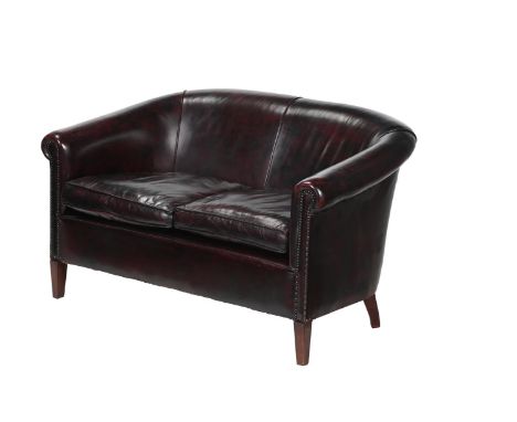 A LEATHER UPHOLSTERED SOFA, IN EARLY 19TH CENTURY STYLE  LATE 20TH CENTURY  With fire label   87cm high, 141cm wide, 87cm dee